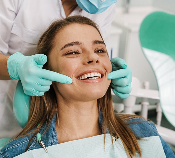 Woman smiling in the dental chair